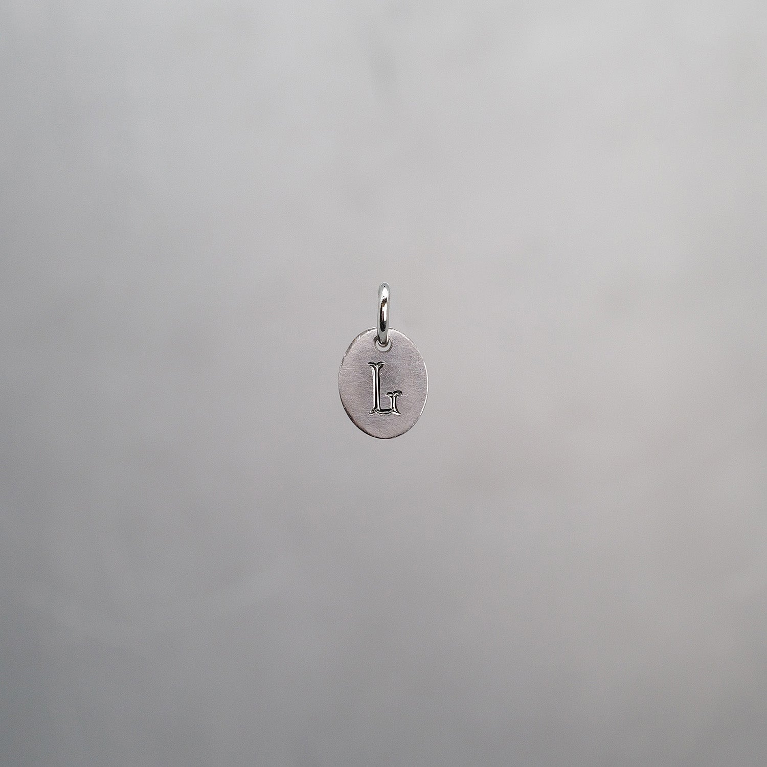 Oval Alphabet Sun Tag