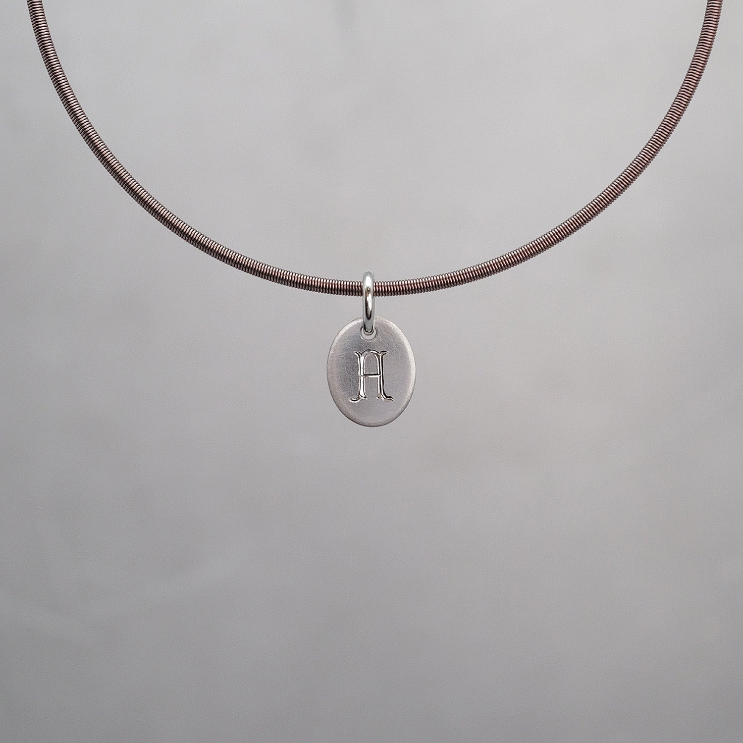 Oval Sun Tag in Platinum 950