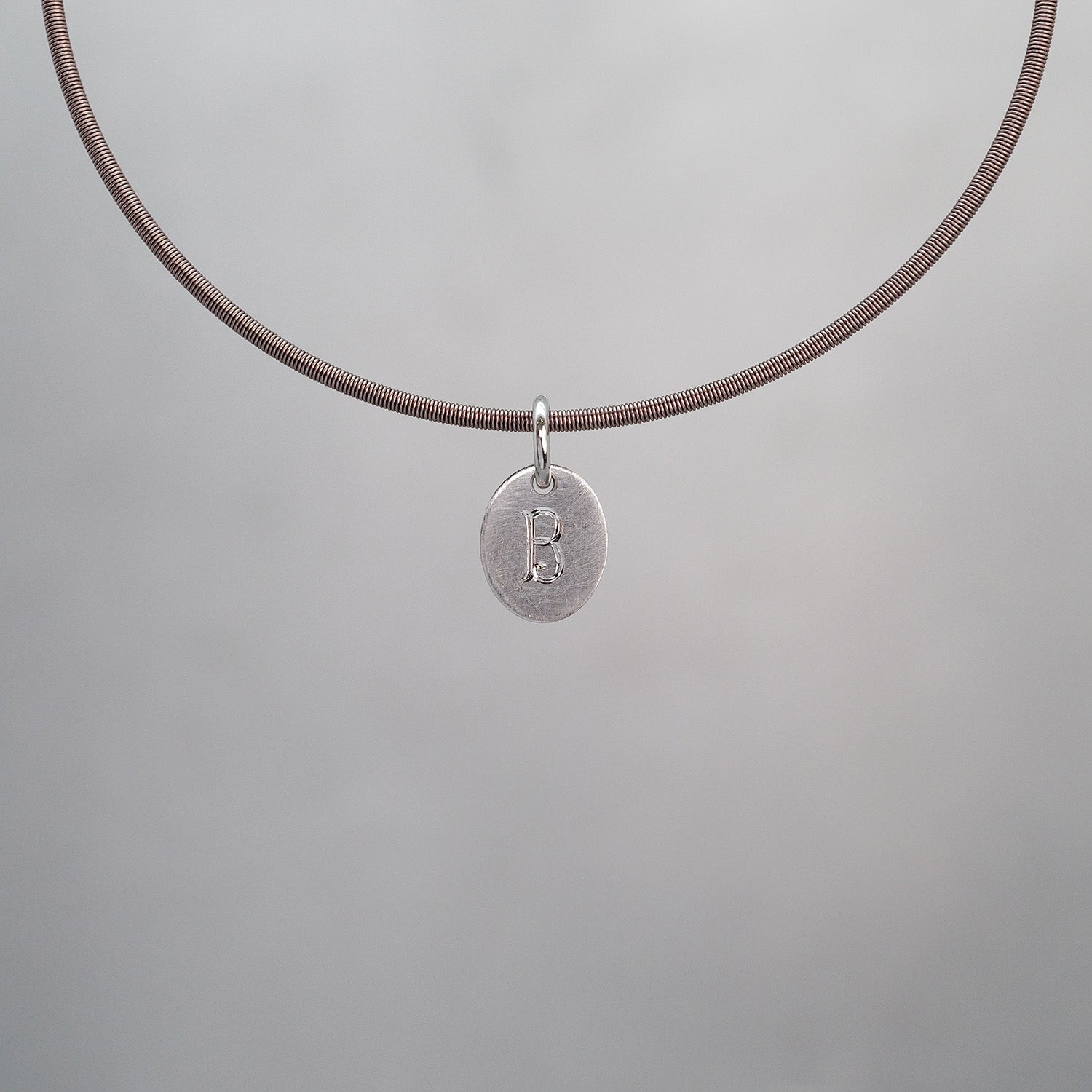 Oval Sun Tag in Platinum 950