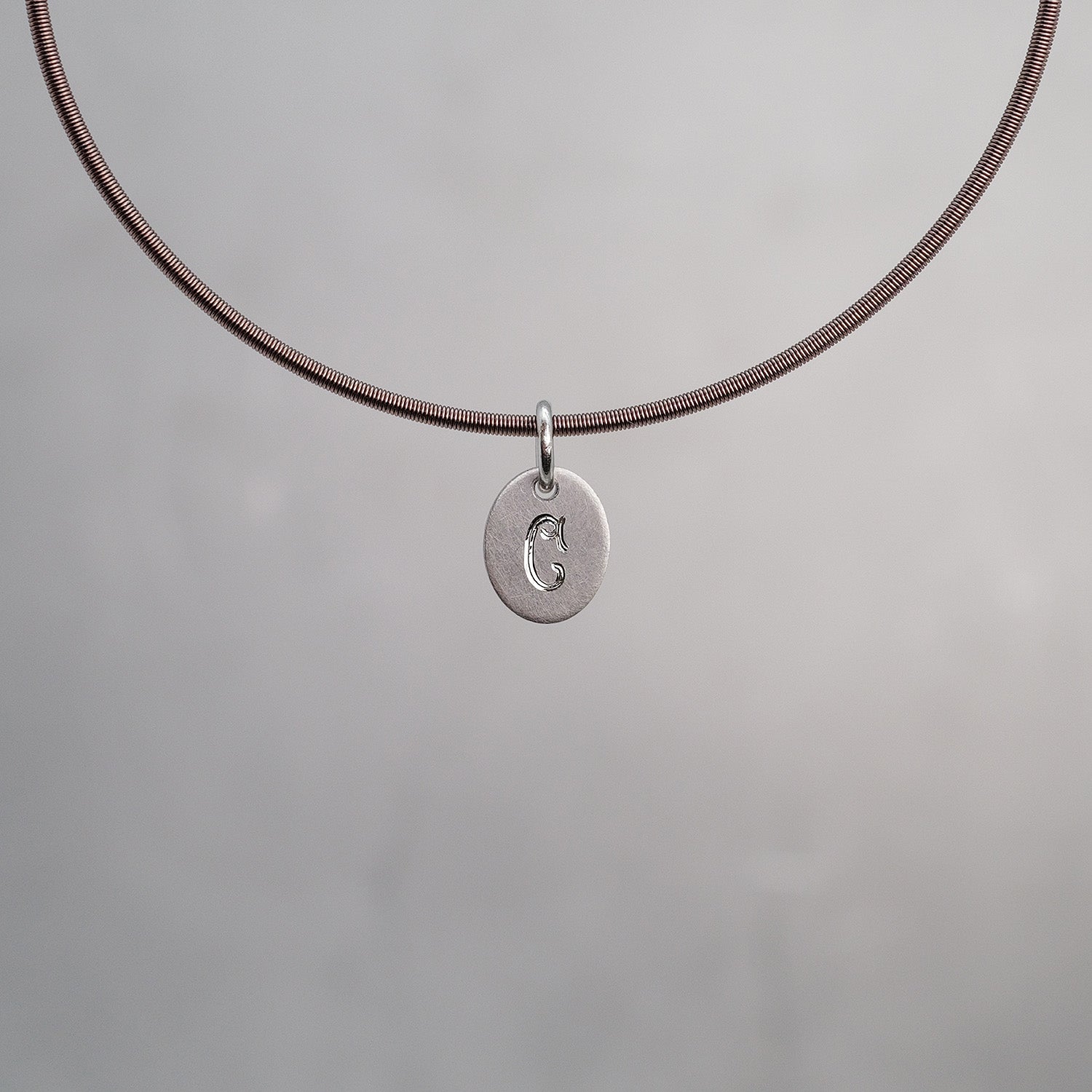 Oval Sun Tag in Platinum 950