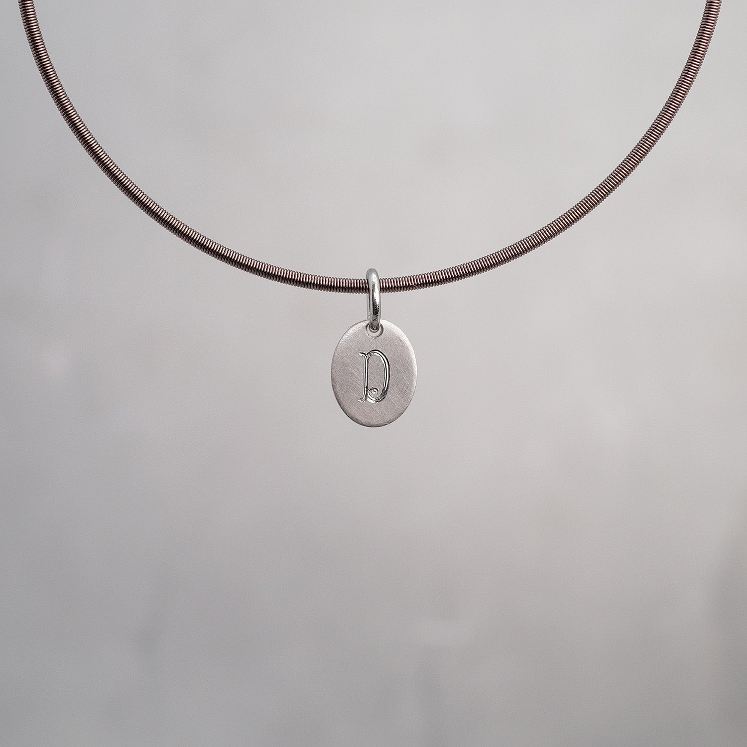 Oval Sun Tag in Platinum 950