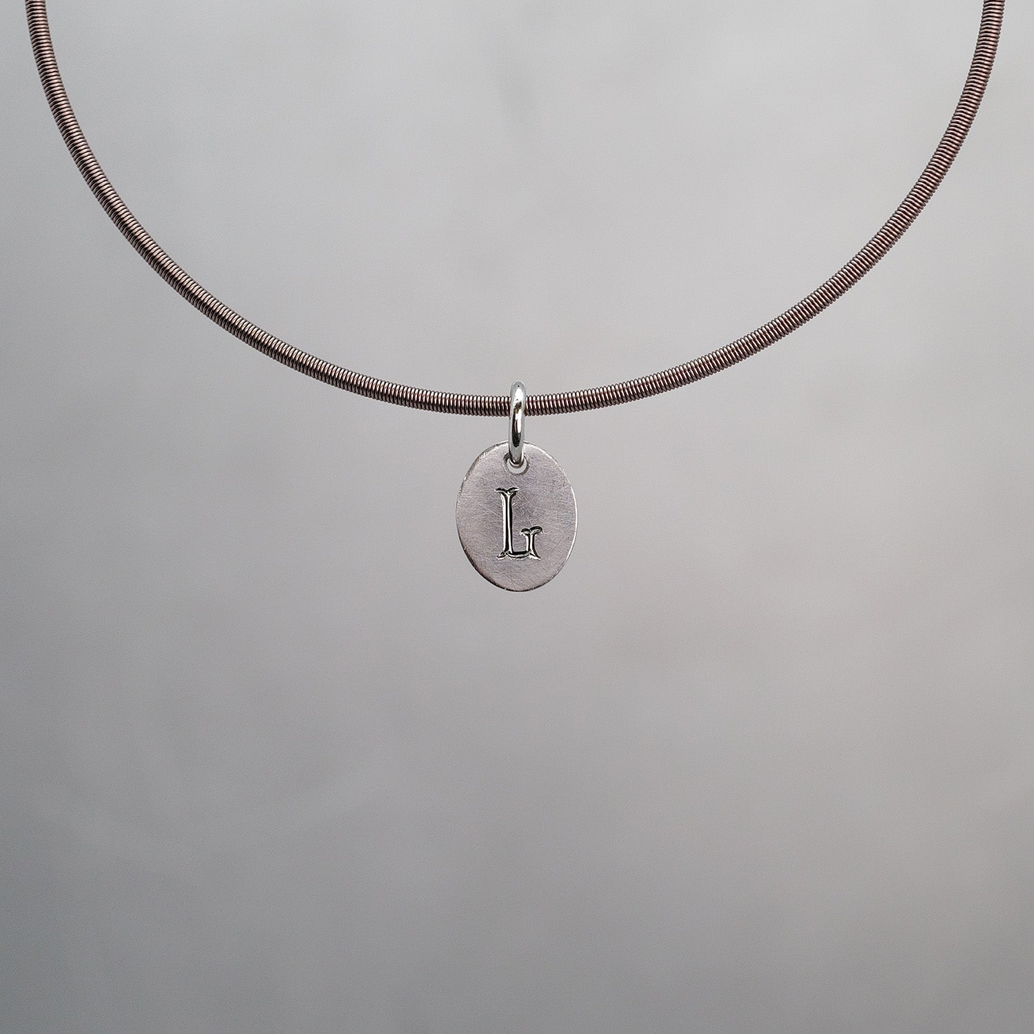 Oval Sun Tag in Platinum 950