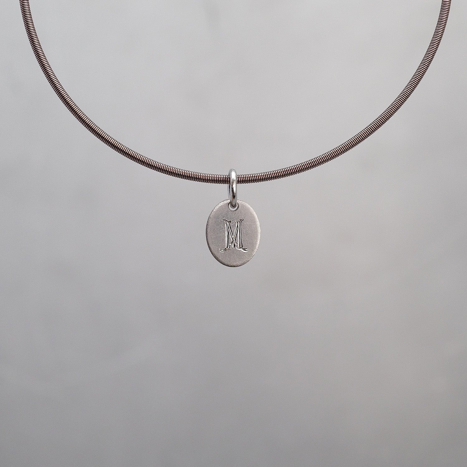 Oval Sun Tag in Platinum 950