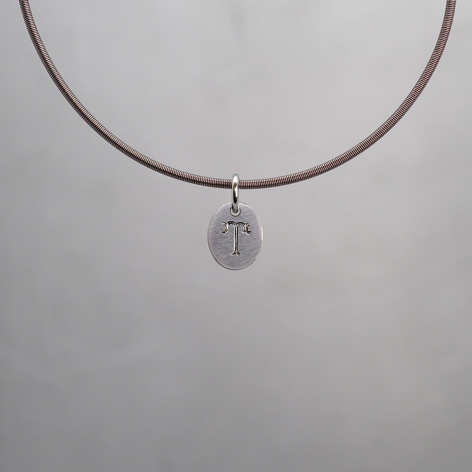 Oval Sun Tag in Platinum 950