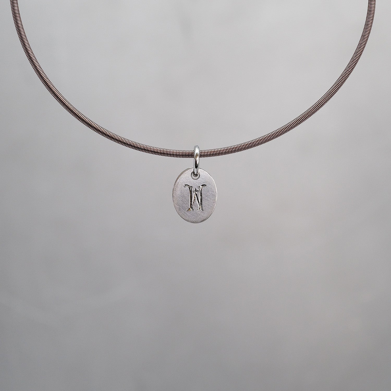 Oval Sun Tag in Platinum 950