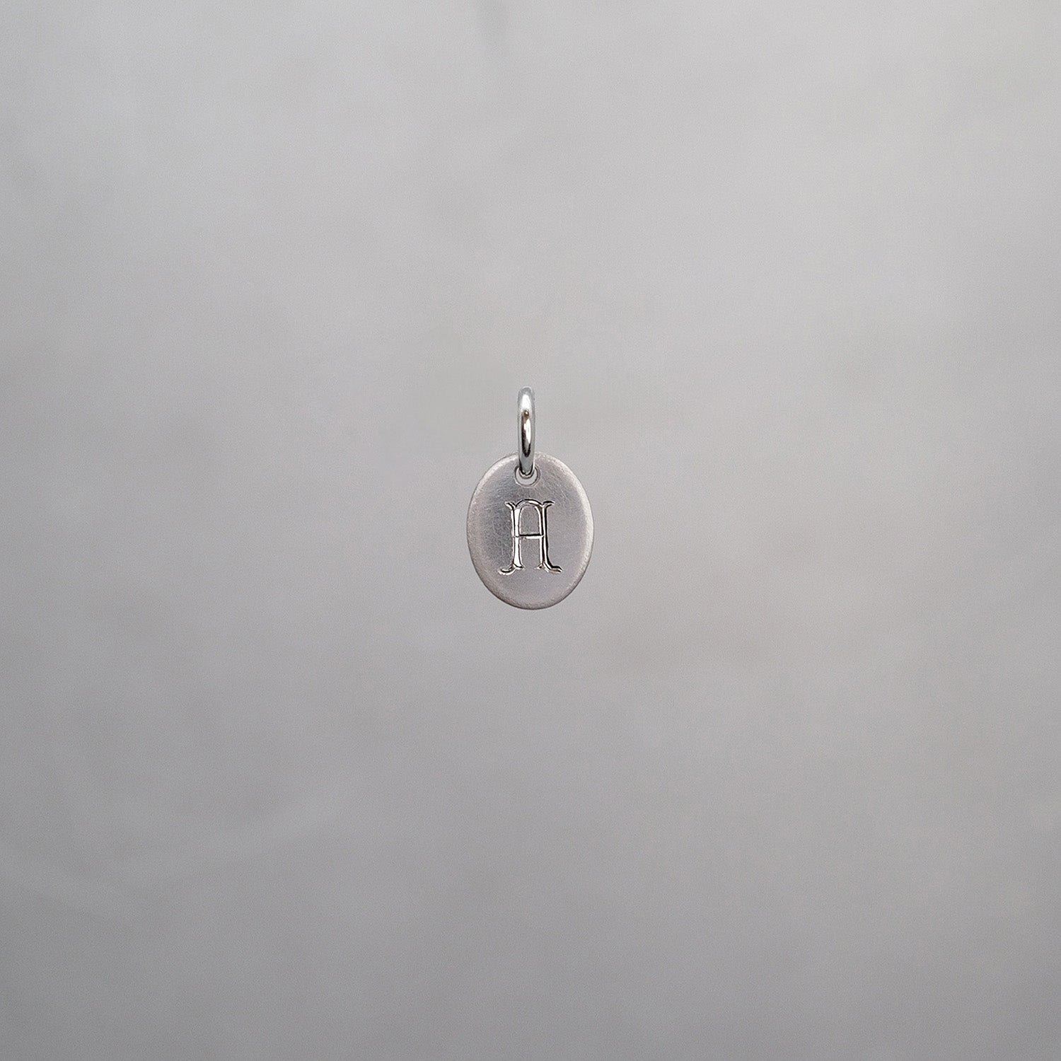 Oval Alphabet Sun Tag